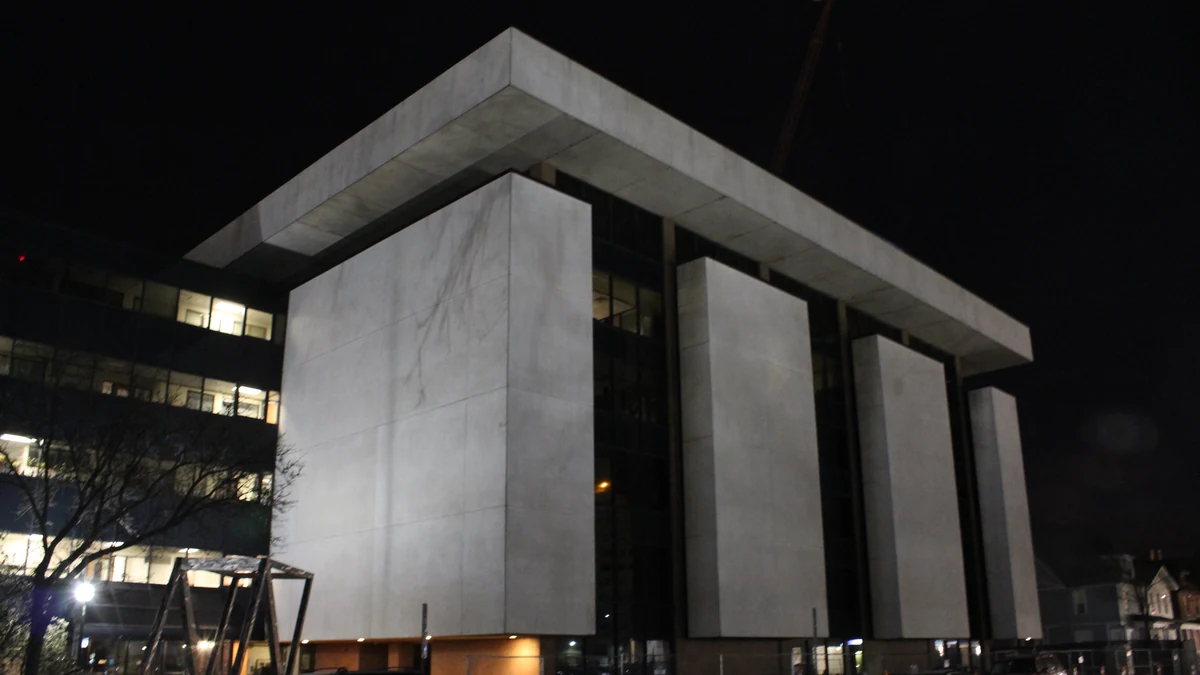Institute for Social Research building at the University of Michigan in Ann Arbor at night.