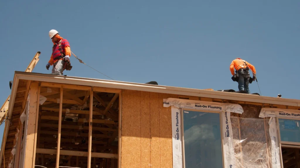 Workers on the roof of a house under construction in Phoenix, Arizona.