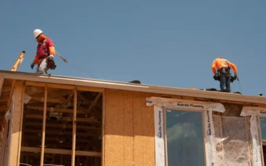 Workers on the roof of a house under construction in Phoenix, Arizona.