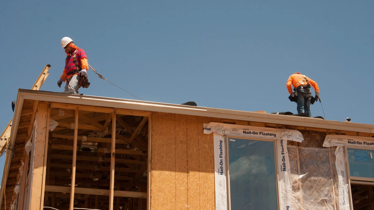 Workers on the roof of a house under construction in Phoenix, Arizona.