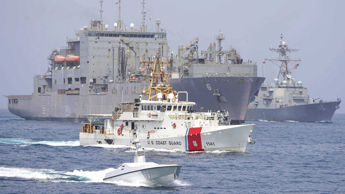 U.S. Coast Guard and U.S. Navy vessels transiting the Strait of Hormuz.