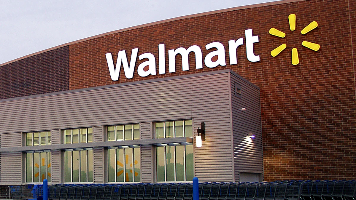 Exterior of a Walmart store with the Walmart logo on the building.