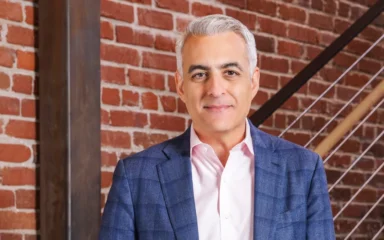 David Wadhwani in an official Adobe portrait.