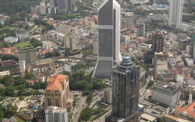 Aerial view of Maybank Tower and surrounding buildings in Kuala Lumpur, Malaysia.