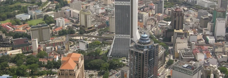 Aerial view of Maybank Tower and surrounding buildings in Kuala Lumpur, Malaysia.