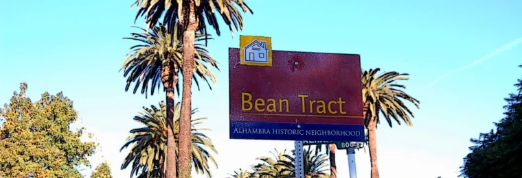 Bean Tract historic neighborhood sign along a palm-lined street in Alhambra, California.