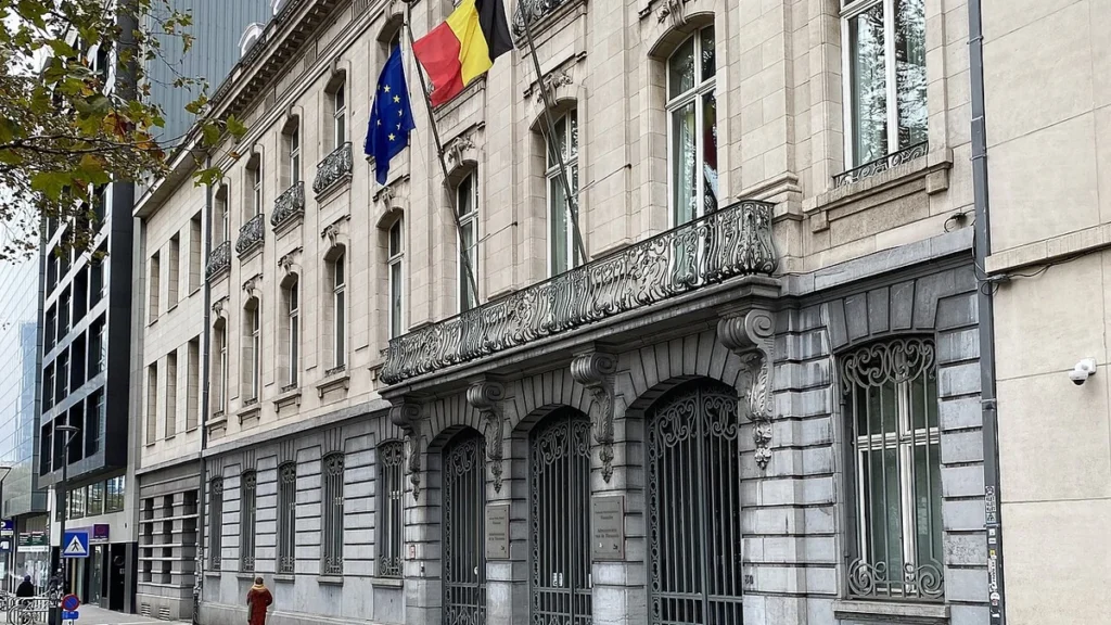Belgian and European Union flags outside the building at Avenue des Arts 30 in Brussels.