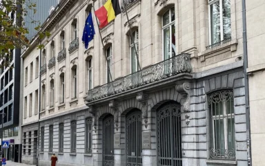 Belgian and European Union flags outside the building at Avenue des Arts 30 in Brussels.