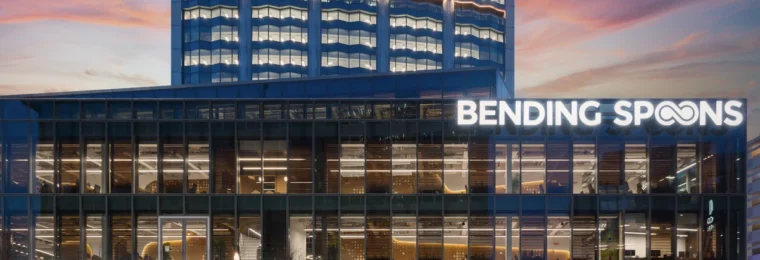 Bending Spoons headquarters in Milan with illuminated company signage.