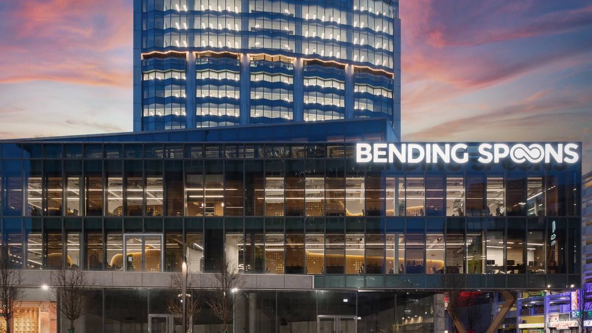 Bending Spoons headquarters in Milan with illuminated company signage.