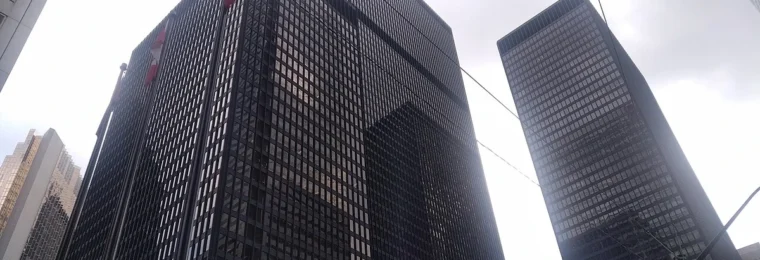 Office towers in Toronto’s Financial District viewed from street level.