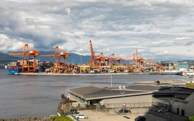 Container cranes and shipping containers at Vancouver Centerm Terminal in British Columbia, Canada.