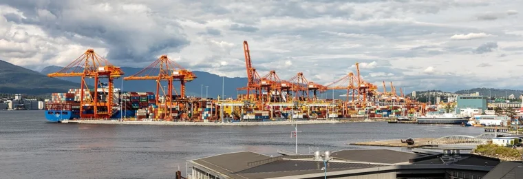 Container cranes and shipping containers at Vancouver Centerm Terminal in British Columbia, Canada.