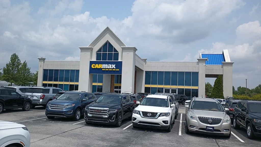 CarMax dealership building and used vehicles in Carmel, Indiana.