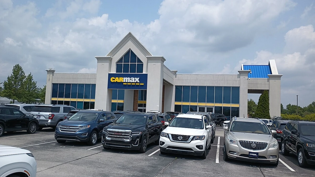 CarMax dealership building and used vehicles in Carmel, Indiana.