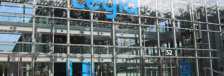 Cegid building in Lyon, France, with the company’s blue logo on the glass facade.