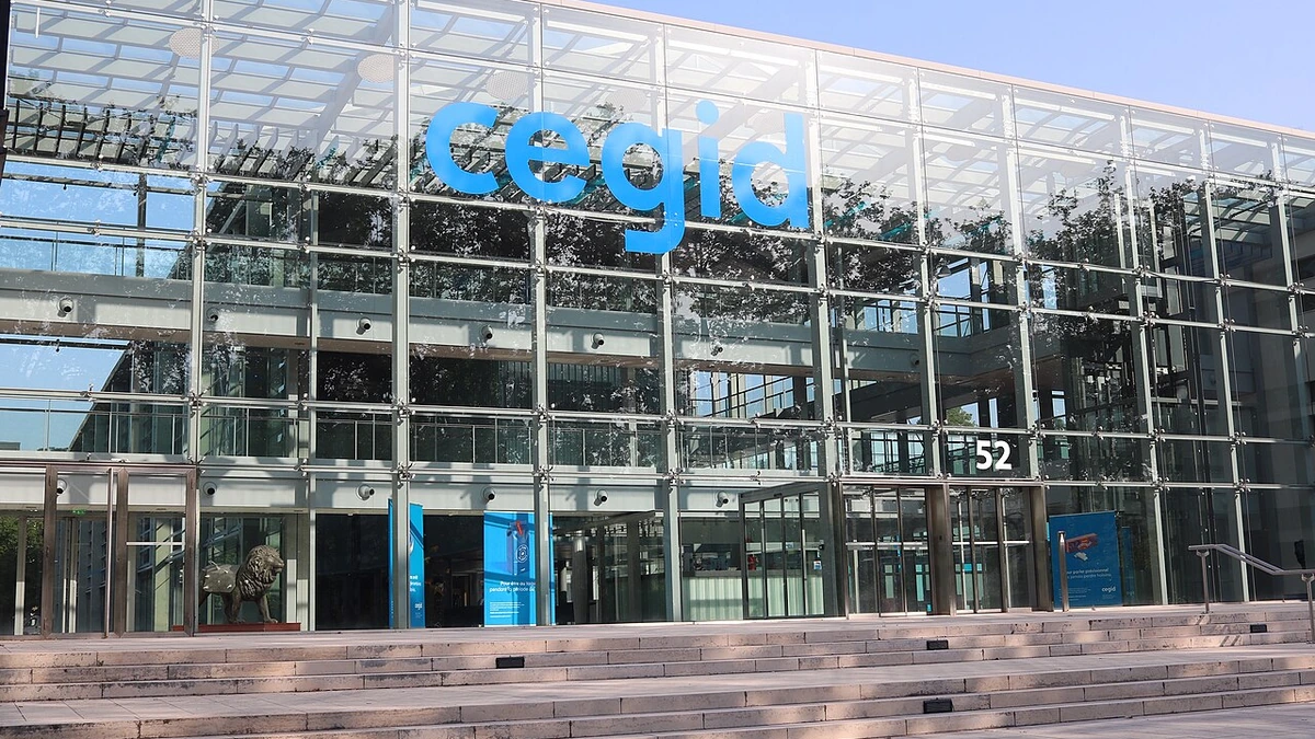 Cegid building in Lyon, France, with the company’s blue logo on the glass facade.