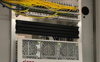 Ciena 6500 optical networking equipment installed in a rack.