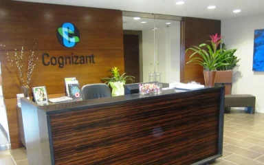 Reception area at Cognizant's office in Teaneck, New Jersey, with Cognizant branding on the wall.