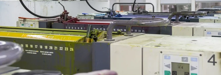 MAN Roland sheetfed offset printing press with ink units and controls.