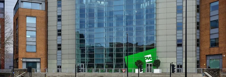 OVO Energy office building in Bristol with green OVO signage above the entrance.