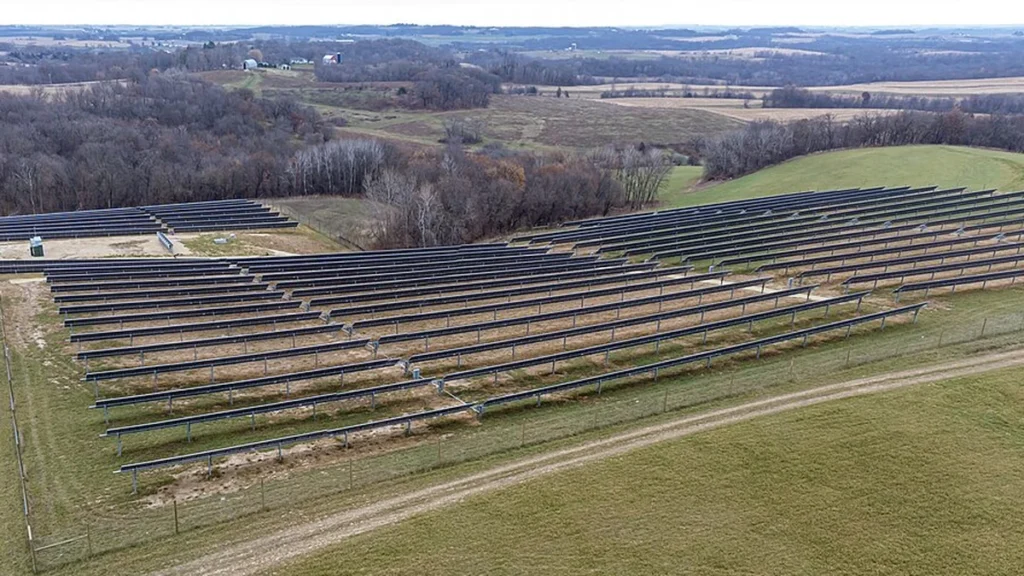 Solar panel arrays across rolling farmland in Wheatland, Wisconsin.