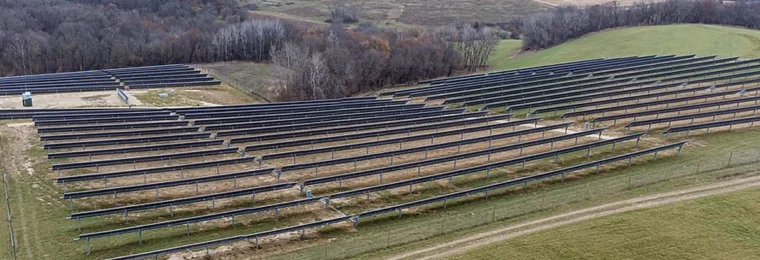 Solar panel arrays across rolling farmland in Wheatland, Wisconsin.