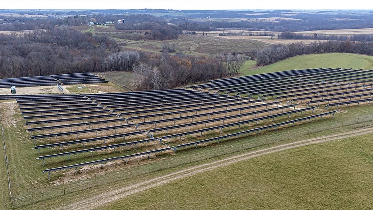 Solar panel arrays across rolling farmland in Wheatland, Wisconsin.