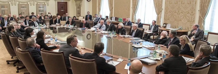 Federal Open Market Committee participants seated around a conference table at the Federal Reserve Board in Washington.