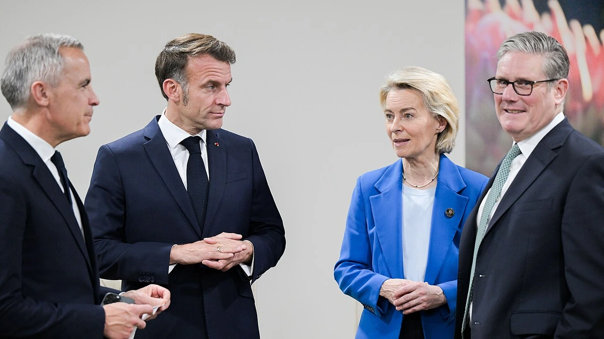 Mark Carney and Emmanuel Macron standing with Ursula von der Leyen and Keir Starmer in Johannesburg in November 2025.