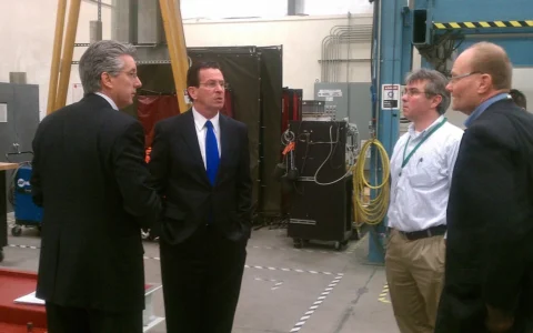 People standing inside FuelCell Energy's manufacturing facility in Torrington, Connecticut.