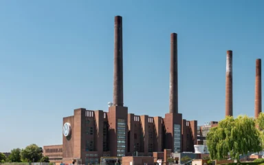 Volkswagen plant buildings and smokestacks in Wolfsburg, Germany.