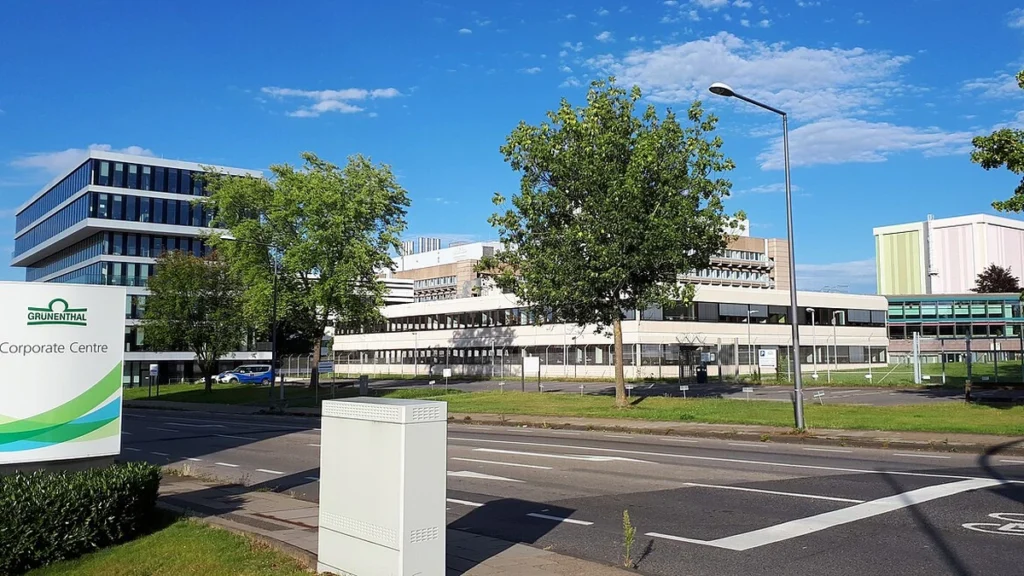 Grünenthal corporate campus in Aachen-Eilendorf, Germany, with company signage in the foreground.