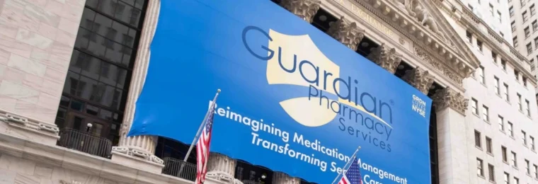 Guardian Pharmacy Services banner displayed on the New York Stock Exchange building.
