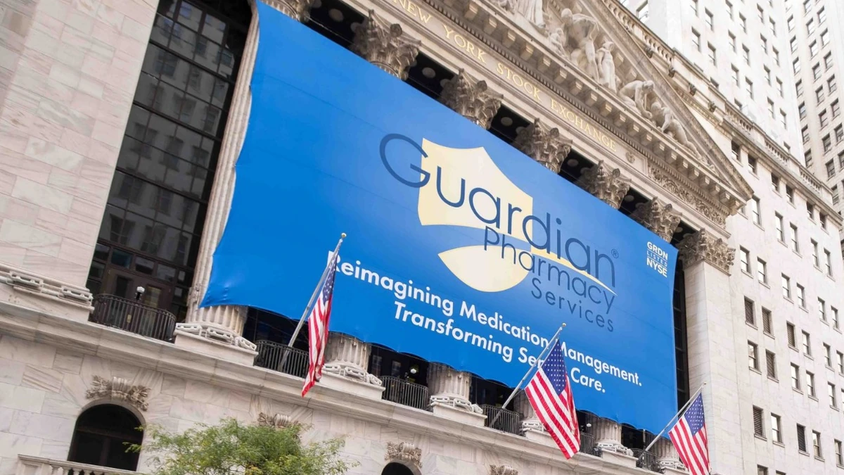 Guardian Pharmacy Services banner displayed on the New York Stock Exchange building.