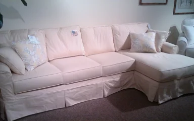Light-colored sectional sofa on display at High Point Market in North Carolina.