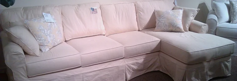 Light-colored sectional sofa on display at High Point Market in North Carolina.