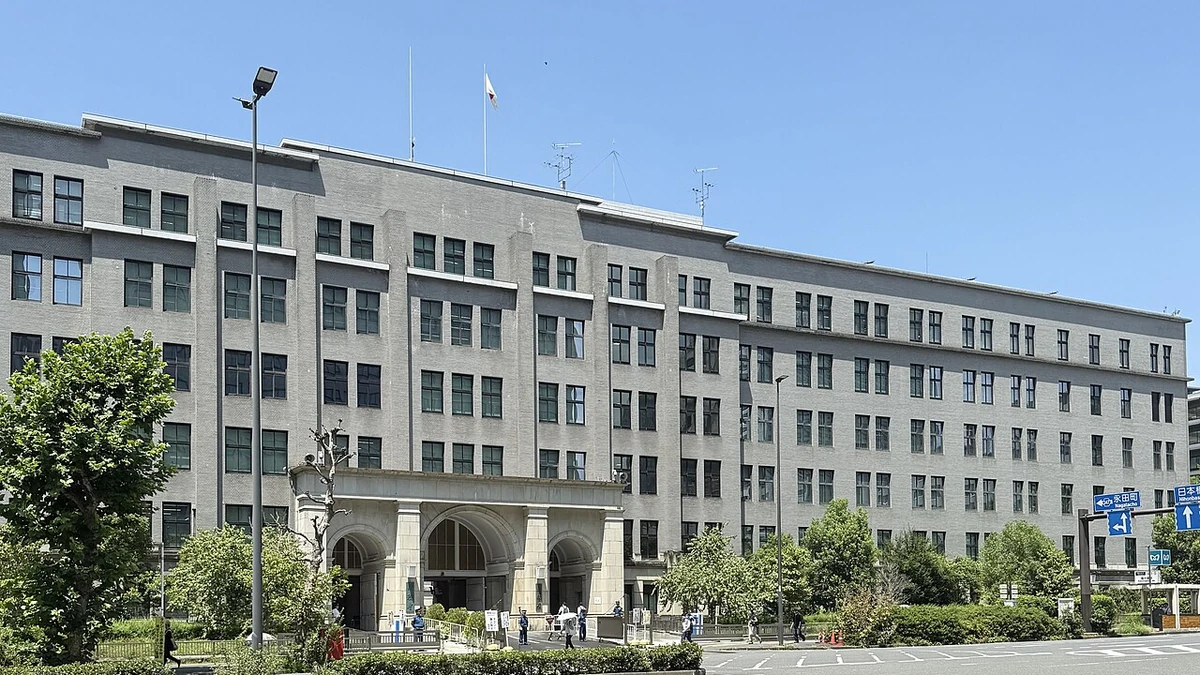 Japan Ministry of Finance headquarters building in Tokyo under a clear blue sky.