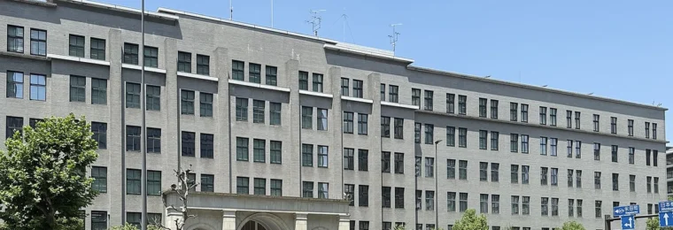 Japan Ministry of Finance headquarters building in Tokyo under a blue sky.