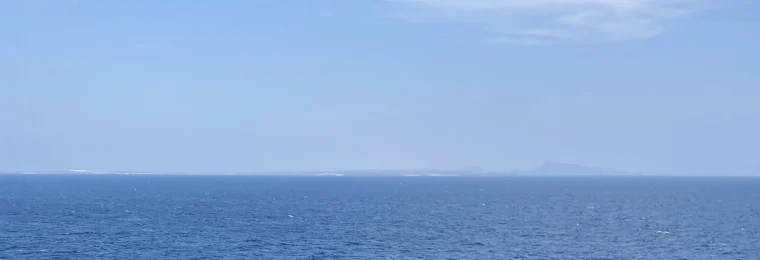 View across the Bab el-Mandeb Strait with Yemen visible in the distance.