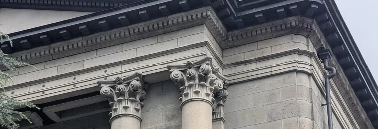 Stone facade and columns of the Bank of Japan Head Office in Tokyo.
