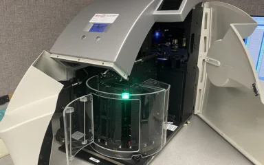 Leica AT2 microscopy slide scanner with its cover open.