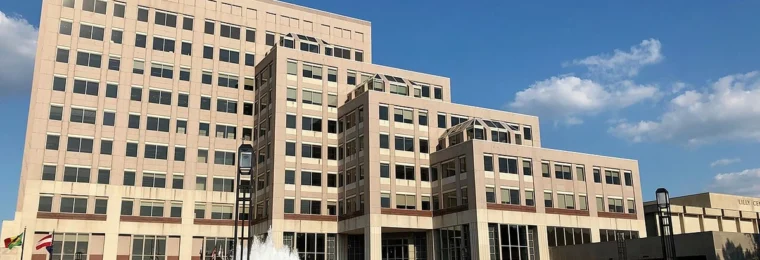 Eli Lilly Corporate Center in Indianapolis, Indiana, with Lilly signage in the foreground.