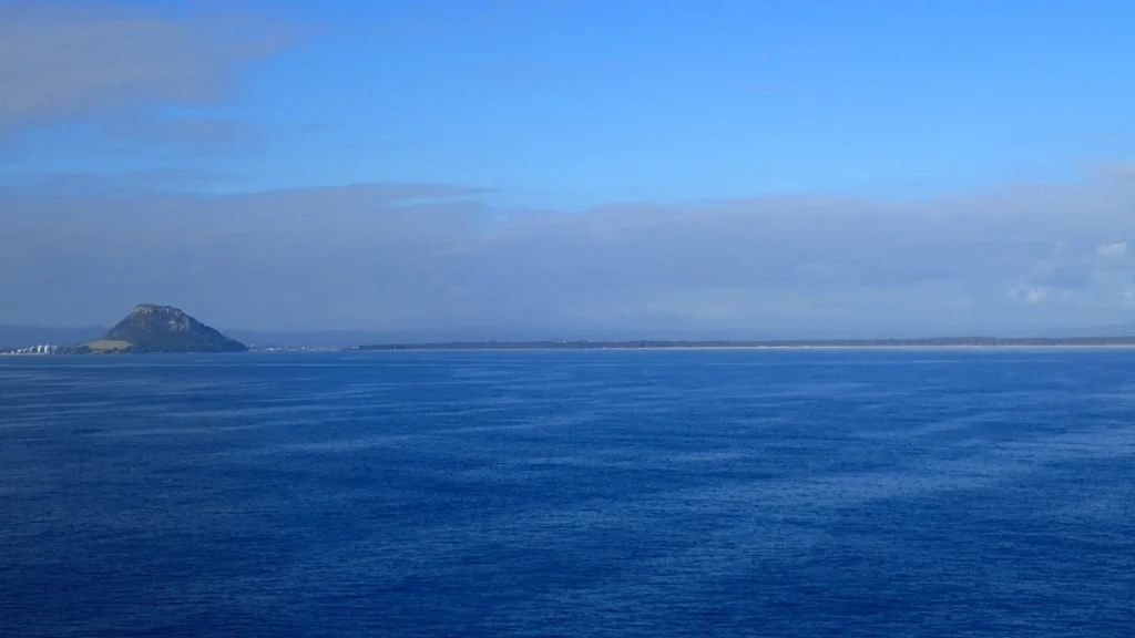 Mauao at left with Matakana Island stretching across the horizon in New Zealand’s Bay of Plenty.