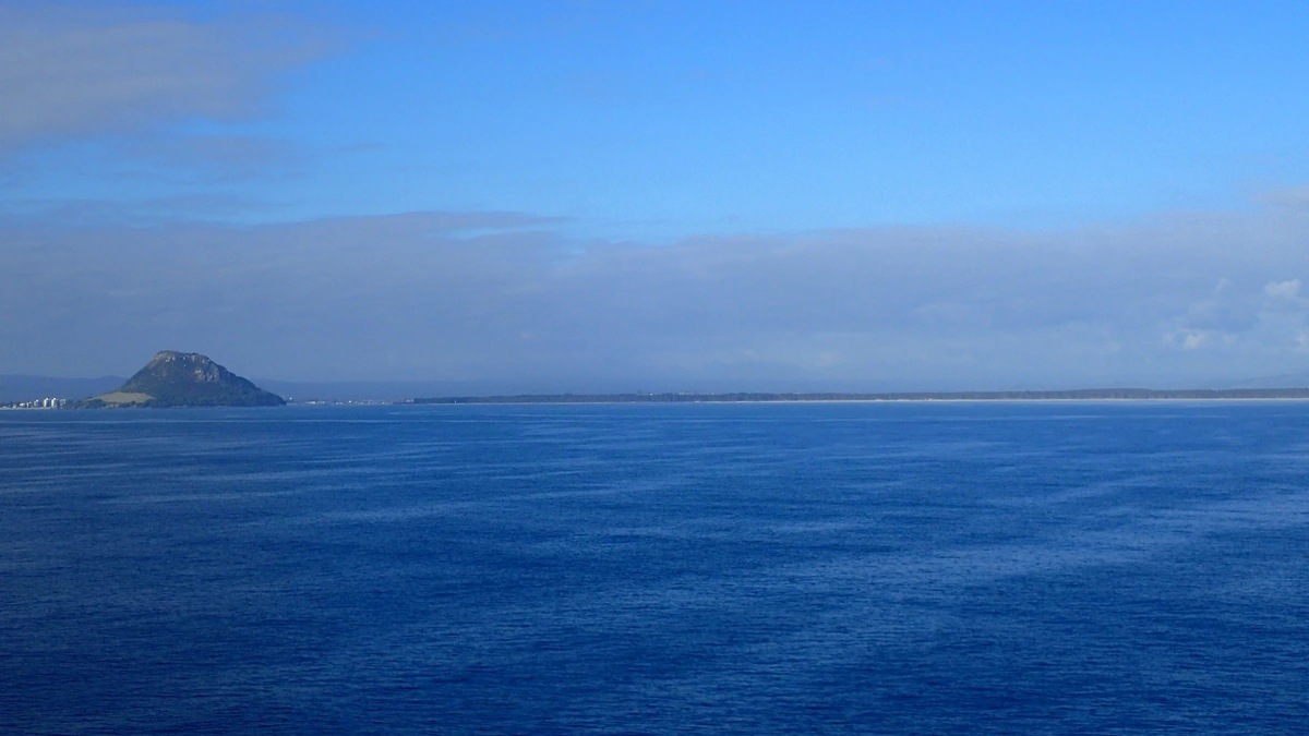 Mauao at left with Matakana Island stretching across the horizon in New Zealand’s Bay of Plenty.