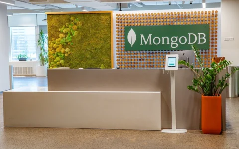 Reception area at MongoDB’s New York City headquarters with a large MongoDB sign behind the front desk.