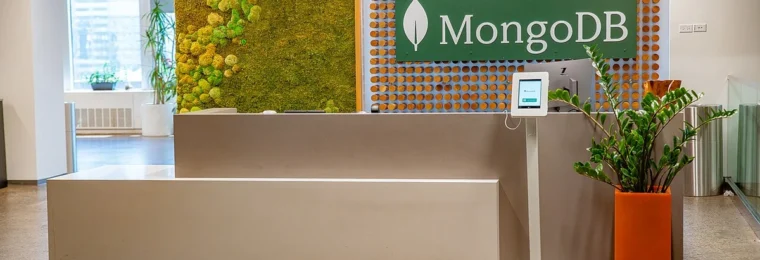 Reception area at MongoDB’s New York City headquarters with a large MongoDB sign behind the front desk.