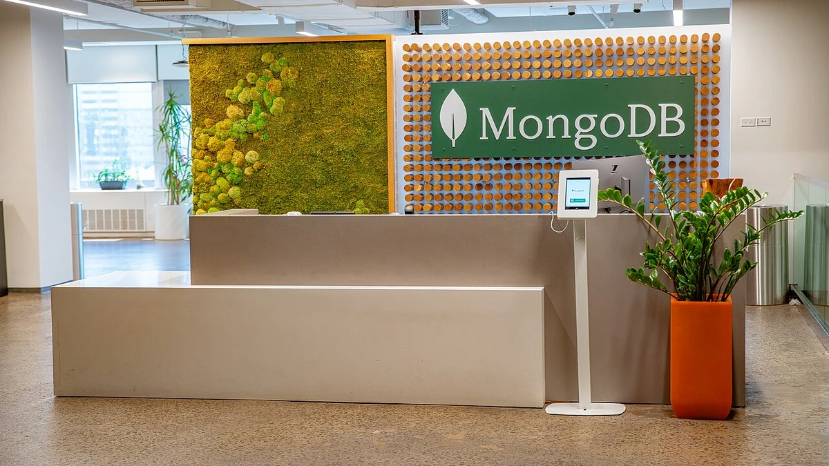 Reception area at MongoDB’s New York City headquarters with a large MongoDB sign behind the front desk.