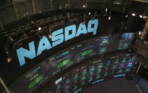 NASDAQ stock market display wall at Times Square in New York.