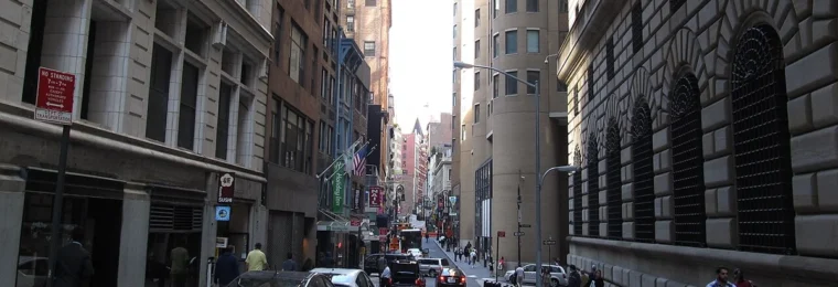 Nassau Street in Lower Manhattan alongside the Federal Reserve Bank of New York building.